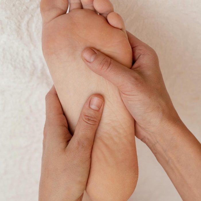 close-up-hands-massage-foot